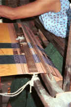 to Jpeg K Indigo thread being woven into a woman's longyi in a house in Amarapura, Shan State 9809e16.jpg