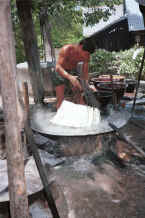 Jpeg 38K Plunging the fresh cotton hanks of thread into the steaming dye bath - Amarapura, Shan State 9809g04.jpg