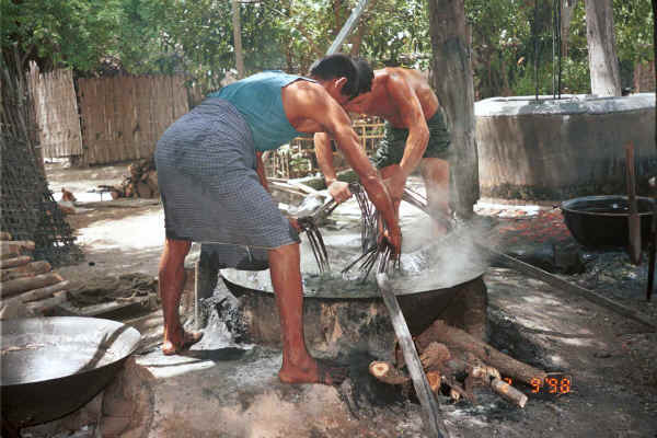 Stirring the cotton hanks around in the dye bath - Amarapura, Shan State 9809g07.jpg