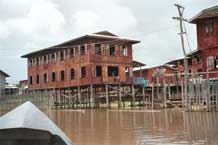 to Jpeg 51K 9809O27 Weaving mill at Innbawkon (Inpawkhon) on Lake Inle, Shan State. 83 women were employed there in September 1998 producing complex, multi-colour silk ikat woven lengths.