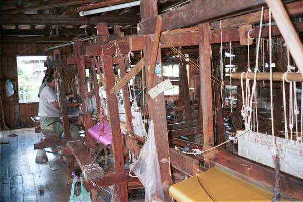 Jpeg 48K 9809O31 Rows of looms in the weaving mill at Innbawkon (Inpawkhon) on Lake Inle, Shan State. 83 women were employed there in September 1998 producing complex, multi-colour silk ikat woven lengths and matching plain lengths.