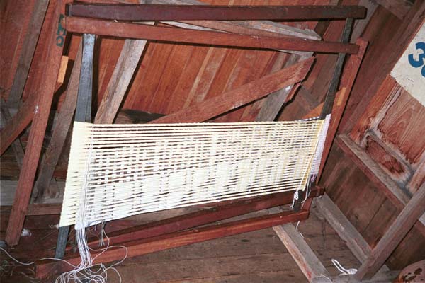 Jpeg 45K 9809O36  Frame with silk weft threads tied off ready for the first dyeing in the ikat preparation process at a weaving mill at Innbawkon (Inpawkhon) on Lake Inle, Shan State.