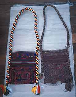 to Jpeg 50K This photo shows two bags: on the left is a new man's bag, Jinghpaw Hkahku, woven by Gwi Kai Nan in Myitkyina, 2002. This was commissioned by the Green Centre at the Brighton Museum (UK) which, in 2001, commissioned weavers in Kachin State to make 17 wedding outfits. The bag on the right has been in Gwi Kai Nan's family for more than four generations. 