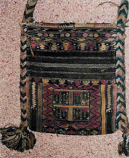 Jpeg 55K A Kachin Jingpho bag in the collection of Bill Hornaday. He describes the main body of the bag as densely woven silk. The braided strap is cotton. He believes that most of the dyes are vegetable, except for some very faded methl violet. He is pretty confident that the reds are lac or madder but that the pink accents are faded chemically died silk. 