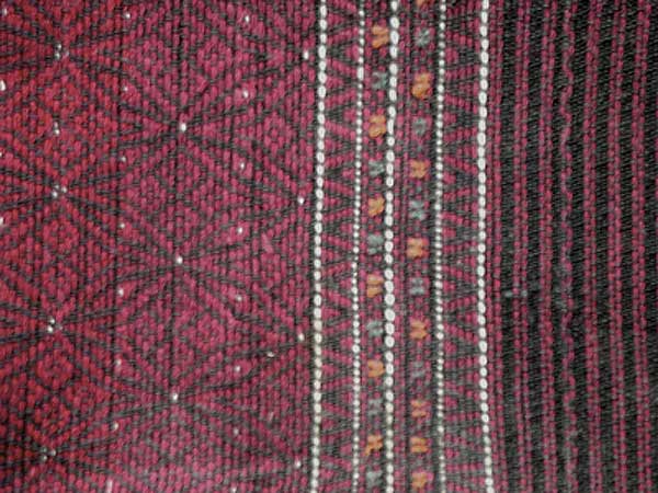 Jpeg 54K Khumi woman's tubeskirt - detail showing the black warp and red, white and black supplementary weft patterning