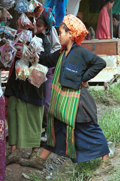 37K Jpeg 9809N15 Close examination of goods for sale by two Pa'O women at Nampan 5-day rotating market, Lake Inle, Shan State