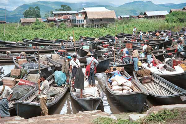 46K Jpeg 9809O02 Boats drawn up at the water's edge for the 5 - day rotating market at Nampan on Lake Inle, Shan State.