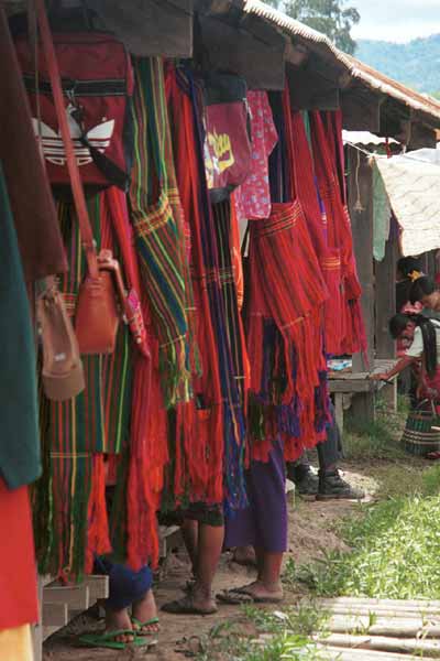 30K Jpeg 9809O03 Pa'O women amongst a mass of shoulder bags on a stall in Nampan 5-day rotating market, Lake Inle, Shan State