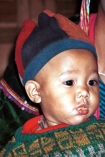 68K Jpeg A Silver Palaung young boy in Pein Ne Bin village near Kalaw, northwestern Shan State. He is wearing a hat made of what appears to be felted fabric in different colours. 