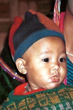 to 68K Jpeg A Silver Palaung young boy in Pein Ne Bin village near Kalaw, northwestern Shan State. He is wearing a hat made of what appears to be felted fabric in different colours. 