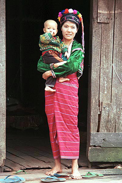 74K Jpeg A mother and son in Pein Ne Bin, a Silver Palaung village in southwestern Shan State. She is wearing the typical woven tube skirt with narrow stripes. The cap that she is wearing would normally be worn by a young girl or unmarried woman.