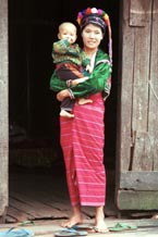 to 74K Jpeg A mother and son in Pein Ne Bin, a Silver Palaung village in southwestern Shan State. She is wearing the typical woven tube skirt with narrow stripes. The cap that she is wearing would normally be worn by a young girl or unmarried woman.