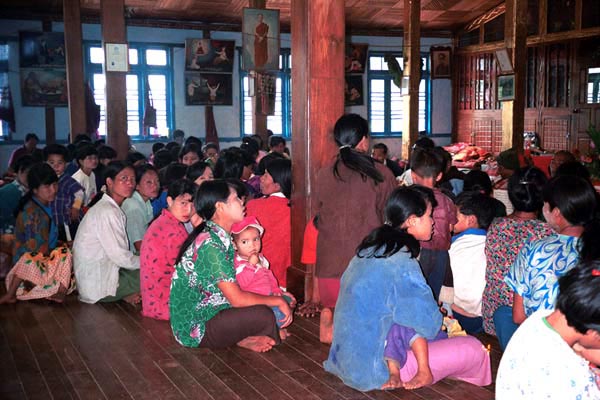 76K Jpeg Silver Palaung gathering together to pray in the Buddhist temple in the centre of Pein Ne Bin village near Kalaw, northwestern Shan State on 'Full Moon Day' after the night of the full moon.