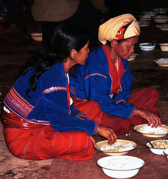 82K Jpeg Two women at the communal meal on the 'Full Moon day' festival in the Silver Palaung village of Pein Ne Bin, near Kalaw, southwestern Shan State. This photograph shows good examples of the traditional costume