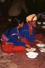 to 82K Jpeg Two women at the communal meal on the 'Full Moon day' festival in the Silver Palaung village of Pein Ne Bin, near Kalaw, southwestern Shan State. This photograph shows good examples of the traditional costume