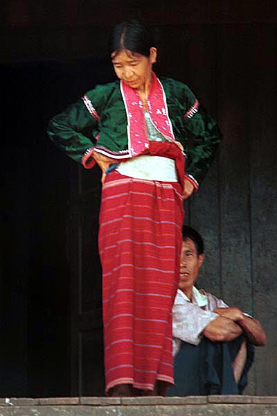 44K Jpeg A Silver Palaung woman in traditional dress on the porch outside a house in Pein Ne Bin village, near Kalaw, southwestern Shan State. This photograph shows a good example of the traditional costume although she does not appear to be wearing any bamboo or rattan hoops.