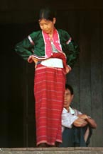 to 44K Jpeg A Silver Palaung woman in traditional dress on the porch outside a house in Pein Ne Bin village, near Kalaw, southwestern Shan State. This photograph shows a good example of the traditional costume although she does not appear to be wearing any bamboo or rattan hoops.