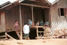 to 67K Jpeg A Silver Palaung family sitting on their porch in Pein Ne Bin village, near Kalaw in southwestern Shan State