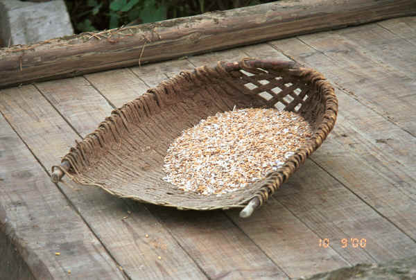 Freshly dried rice in a basket scoop - Bi Ke village, Mi Gu township, Zhenfeng county, Guizhou province 0010s05.jpg