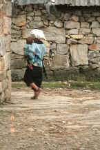 Jpeg 38K Bouyei woman and baby walking through the village showing the original dry stone walling of the houses - Bi Ke village, Mi Gu township, Zhenfeng county, Guizhou province 0010s13.jpg