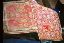 Jpeg 50K Close-up of couched embroidery baby carrier - style embroidery and batik strap would suggest this is a Side Comb Miao carrier - Chang Tion village, Cheng Guan township, Puding county, Guizhou province 0010w30.jpg