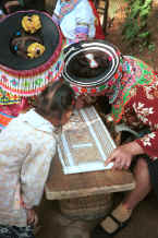 Jpeg 67K Focusing on developing the batik design - We saw some very fine batik work in this village - Da Shu Jia village, Xin Zhou township, Longlin county, Guangxi province 0010i08.jpg