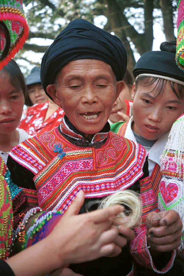 Clean Water Miao old lady examining hemp or ramie fibre - Da Shu Jia village, Xin Zhou township, Longlin county, Guangxi province 0010i17.jpg