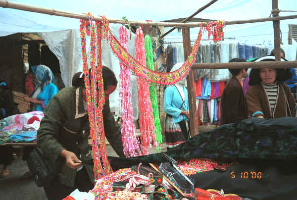 Market stall with trimmings for Miao traditional style costumes - De Wo market, De Wo township, Longlin county, Guangxi province 0010g21.jpg