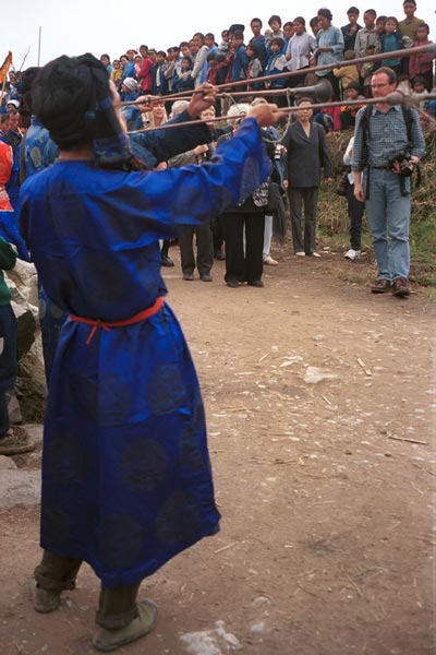 Jpeg 49K  0110D27 Long trumpets being blown as part of our welcome to Gan He village, Ya Rong township, Huishui county, Guizhou province, south-west China. The people living in this village are known as Qing Miao. 