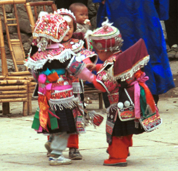 Jpeg 109K Iron beating Miao festival costume in miniature worn by little girls dancing in Gao Zhai village, Bai Jin township, Huishui county, Guizhou province 0110C07