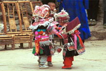 to Jpeg 109K Iron beating Miao festival costume in miniature worn by little girls dancing in Gao Zhai village, Bai Jin township, Huishui county, Guizhou province 0110C07