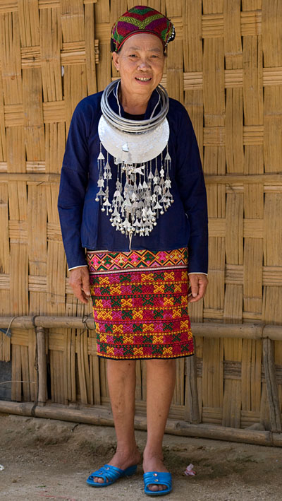 Huang Ji Xiang, a member of the Qi subgroup of the Li people, wearing her festival outfit, including a skirt decorated with the technique shown in the other photos and described by Chris who thinks that it was made by her in the 1980s-90s.