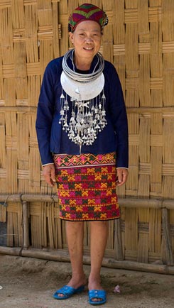 121K Jpg - Huang Ji Xiang, a member of the Qi subgroup of the Li people, wearing her festival outfit, including a skirt decorated with the technique shown in the other photos and described by Chris who thinks that it was made by her in the 1980s-90s.