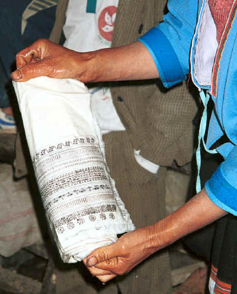 Side comb Miao - waxed roll for the top of a skirt rolled ready for the first dipping into the indigo dye pot - Long Dong village, De Wo township, Longlin country, Guangxi province 0010e37.jpg