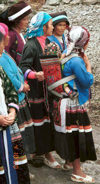 Side comb Miao women with baby in embroidered baby carrier - Long Dong village, De Wo township, Longlin country, Guangxi province 0010f15.jpg