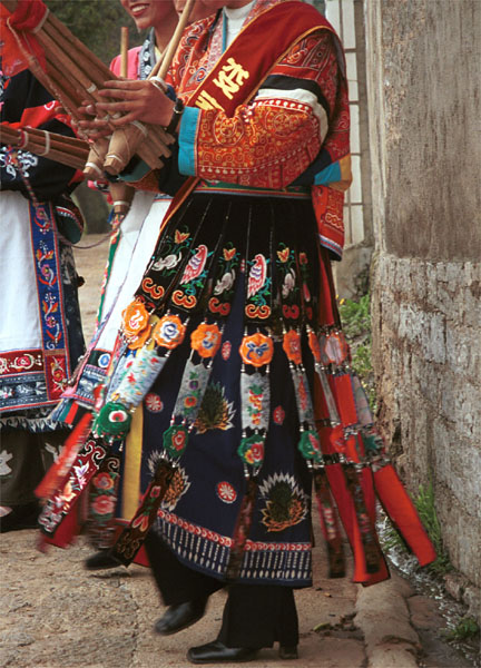 Jpeg 105K This Miao woman has a skirt and silver head dress which is not local to this area. It may have been adopted to create more of a stir in the dance competitions or she might have maried into the village from elsewhere. Lou Jia Zhuang village, Anshun city, Guizhou province. 0110A25