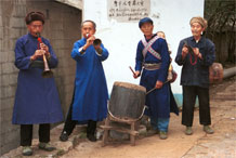 to Jpeg 75K Welcoming musicians at the entrance to Lou Jia Zhuang village, Anshun city, Guizhou province 0110A34 