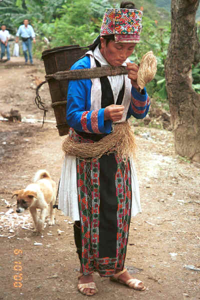 White Miao woman splicing lengths of hemp or ramie 0010j15.jpg