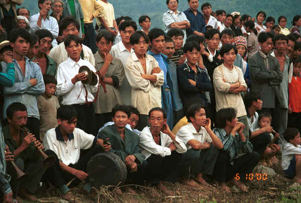 Crowd of White Miao men, some playing instruments, Ma Wo village, Zhe Lang township, Longlin county, Guangxi province 0010j25.jpg