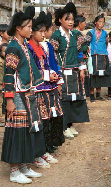 Side Comb Miao girls with two older women all in their festival finery - Pao Ma Cheng village, Teng Jiao township, Xingren country, Guizhou province 0010n08.jpg