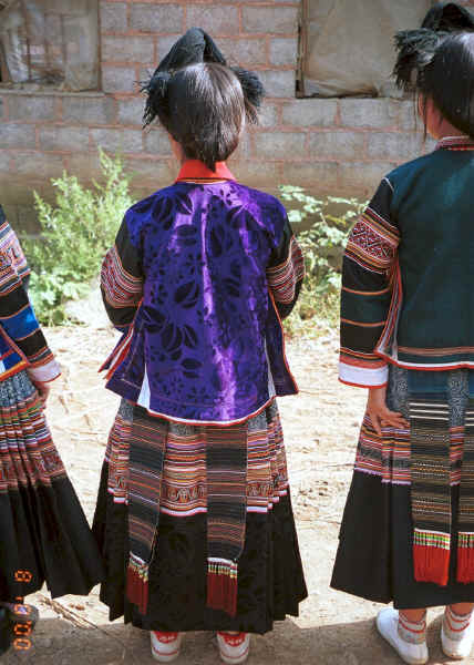 Back view of Side Comb Miao girls in festival finery - Pao Ma Cheng village, Teng Jiao township, Xingren country, Guizhou province 0010n11.jpg