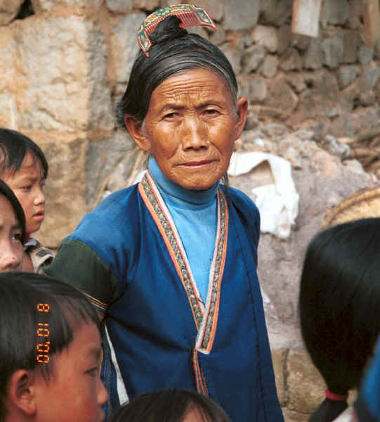 Married Side Comb Miao woman clearly showing the 'side comb' which gives the minority their Han nickname - Pao Ma Cheng village, Teng Jiao township, Xingren country, Guizhou province 0010n16.jpg