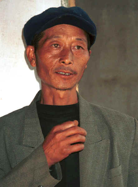 Head man of the Side Comb Miao village,  Pao Ma Cheng, Teng Jiao township, Xingren country, Guizhou province 0010o02A.jpg