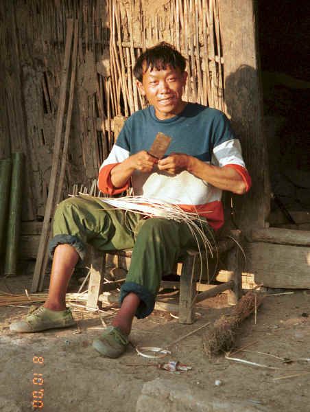 Side Comb Miao basket maker outside his house Pao Ma Cheng, Teng Jiao township, Xingren country, Guizhou province 0010o21.jpg