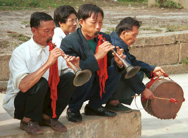 Musicians in the village playing for the dancers - Sha Jiao village, Wan Teng township, Xingyi metropolitan area, Guizhou province 0010l27.jpg