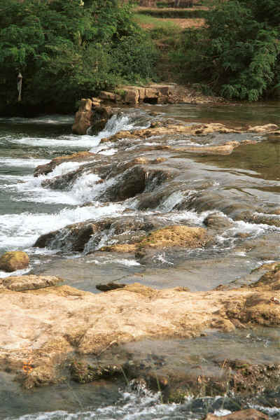 Tumbling water in the river as it approaches the entrance to Shitou village, Huanggousu township, Zhen Nin county, Guizhou province 0010t31.jpg