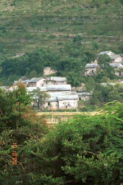 Stone houses climbing up the hillside out of the village - Shitou village, Huanggousu township, Zhen Nin county, Guizhou province 0010t34.jpg