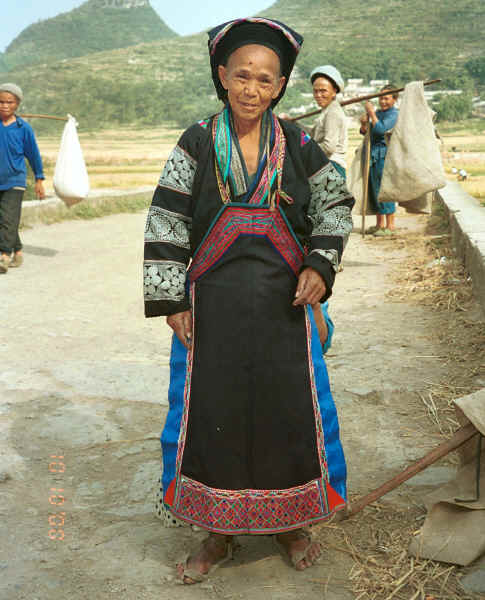 Old Bouyei textile seller modelling the jacket which I had just bought - Shitou village, Huanggousu township, Zhen Nin county, Guizhou province 0010u10.jpg