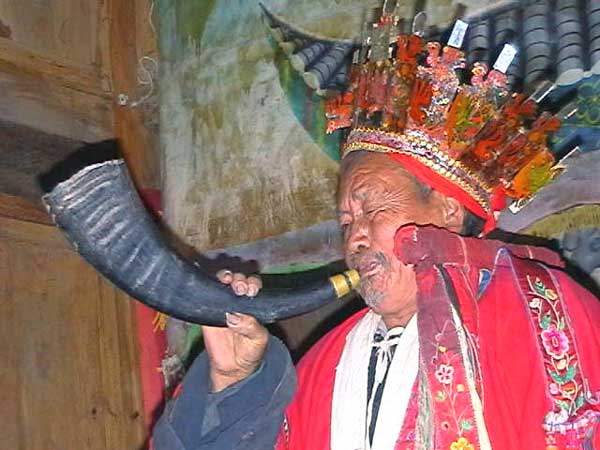 41K Jpeg Miao man blowing a horn during a festival in a village in Songtao Miao Autonomous County, Tongren Prefecture, eastern Guizhou Province.