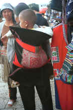 Jpeg 24K Sani baby in a traditional embroidered baby carrier - Stone Forest, Shilin, Stone Forest county, Yunnan province 0010b05.jpg